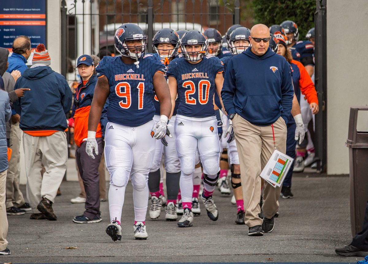 Joe Susan leading the Bucknell football team onto the field on game day